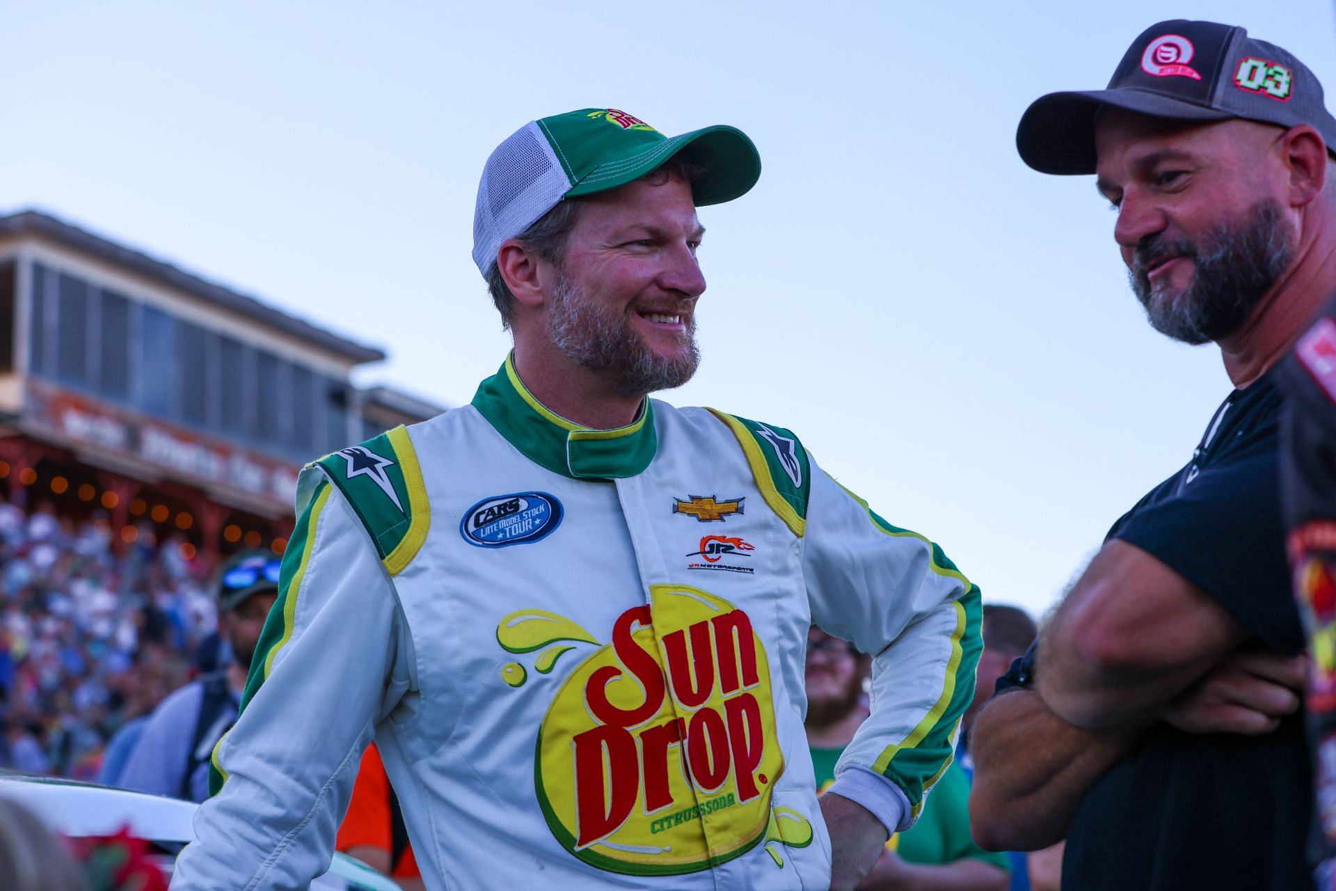 Dale Earnhardt Jr. speaks with Mike Queen before the 2022 Cars Tour LMSC 125 at the North Wilkesboro Speedway. Source: Getty